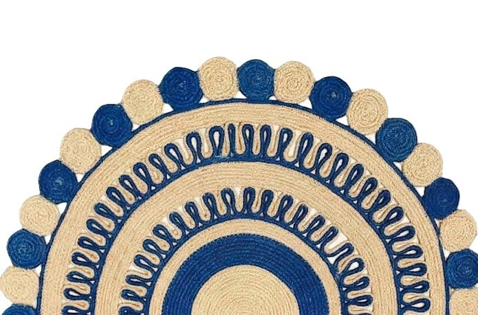 Round natural and blue jute area rug with concentric circles and decorative scalloped bobble edges.