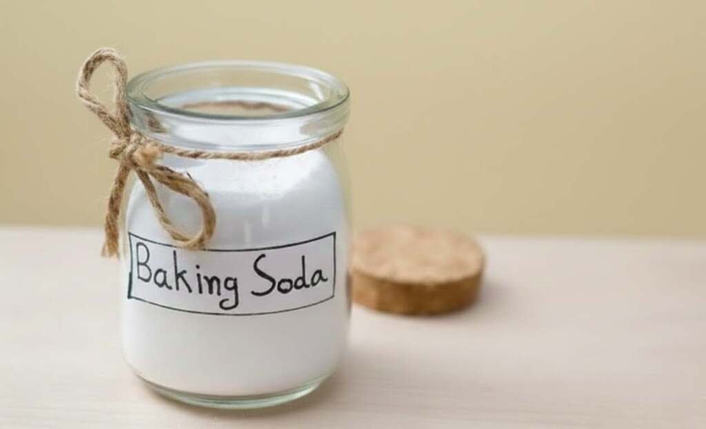 Jar of Baking Soda tied with twine. Use baking soda to deodorize and clean seagrass baskets safely.