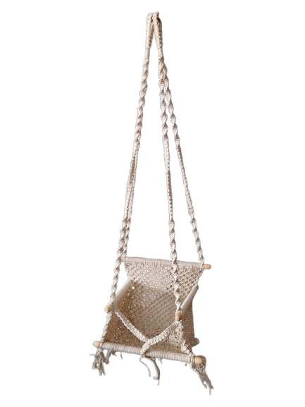 Intricate macramé baby swing with twisted rope supports and wooden frame for nursery décor.