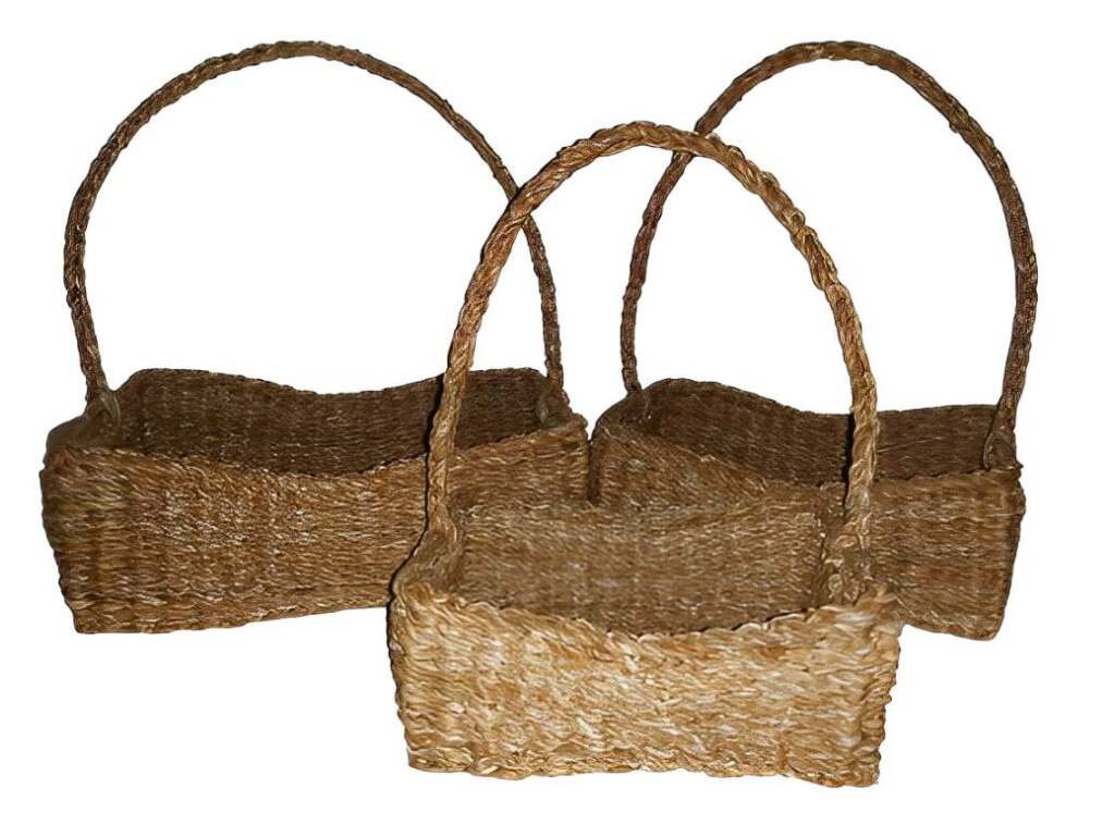 Three rectangular woven seagrass baskets with tall handles, isolated on a white background.