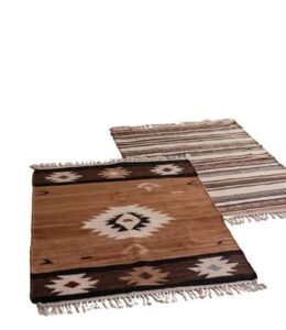 Two small woven rugs with brown and white geometric tribal patterns and fringed edges.