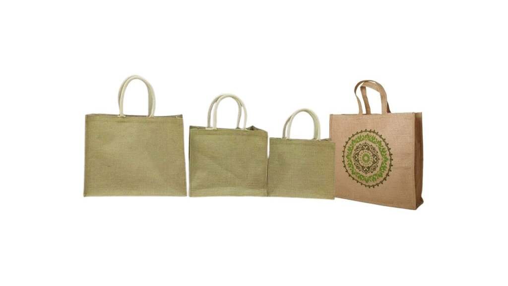Set of four eco-friendly brown jute shopping bags, including one with a green circular mandala design.