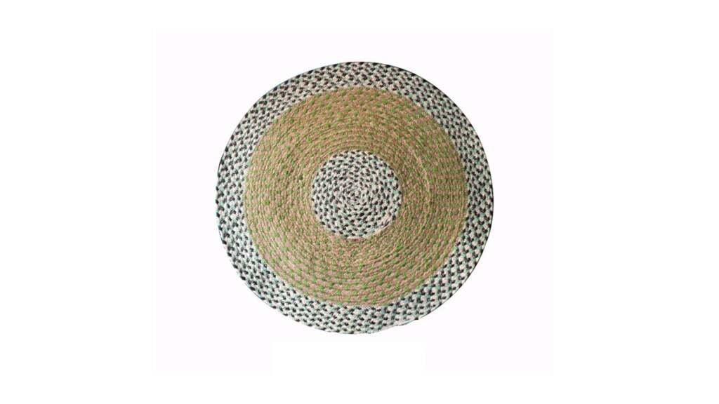 Round braided jute placemat with green and black accents for eco-friendly table settings.