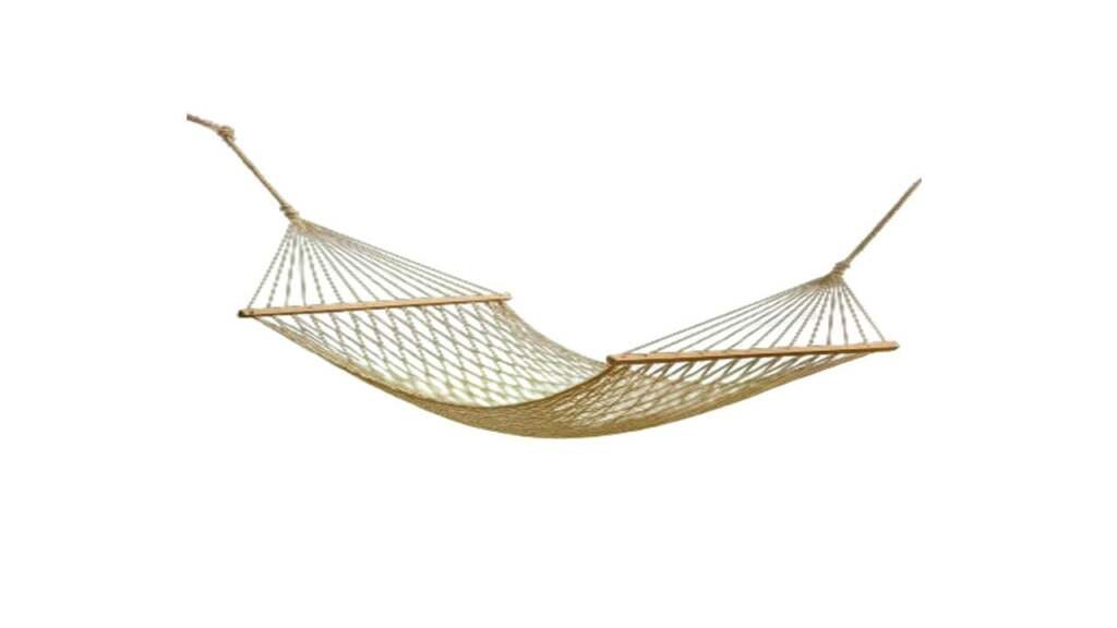 Traditional jute rope net hammock with wooden spreader bars for backyard relaxation.