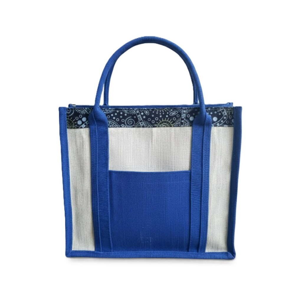 Multi-functional white and blue jute tote bag wholesale with a large front pocket and patterned trim.